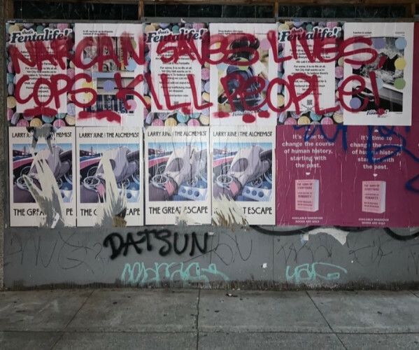 "Narcan saves lives, cops kill people!" graffiti in San Francisco."